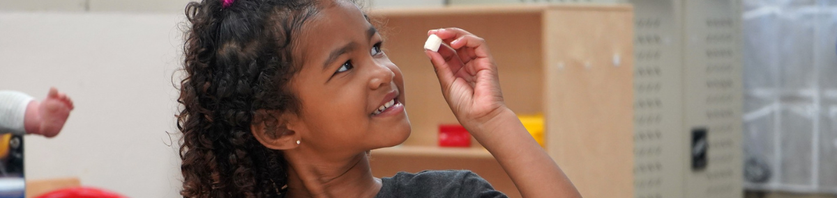Girl holding marshmallow